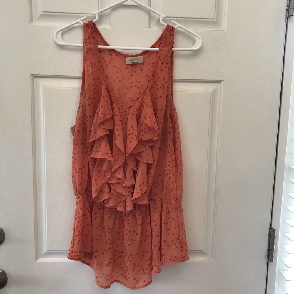 Sheer orange sleeveless blouse